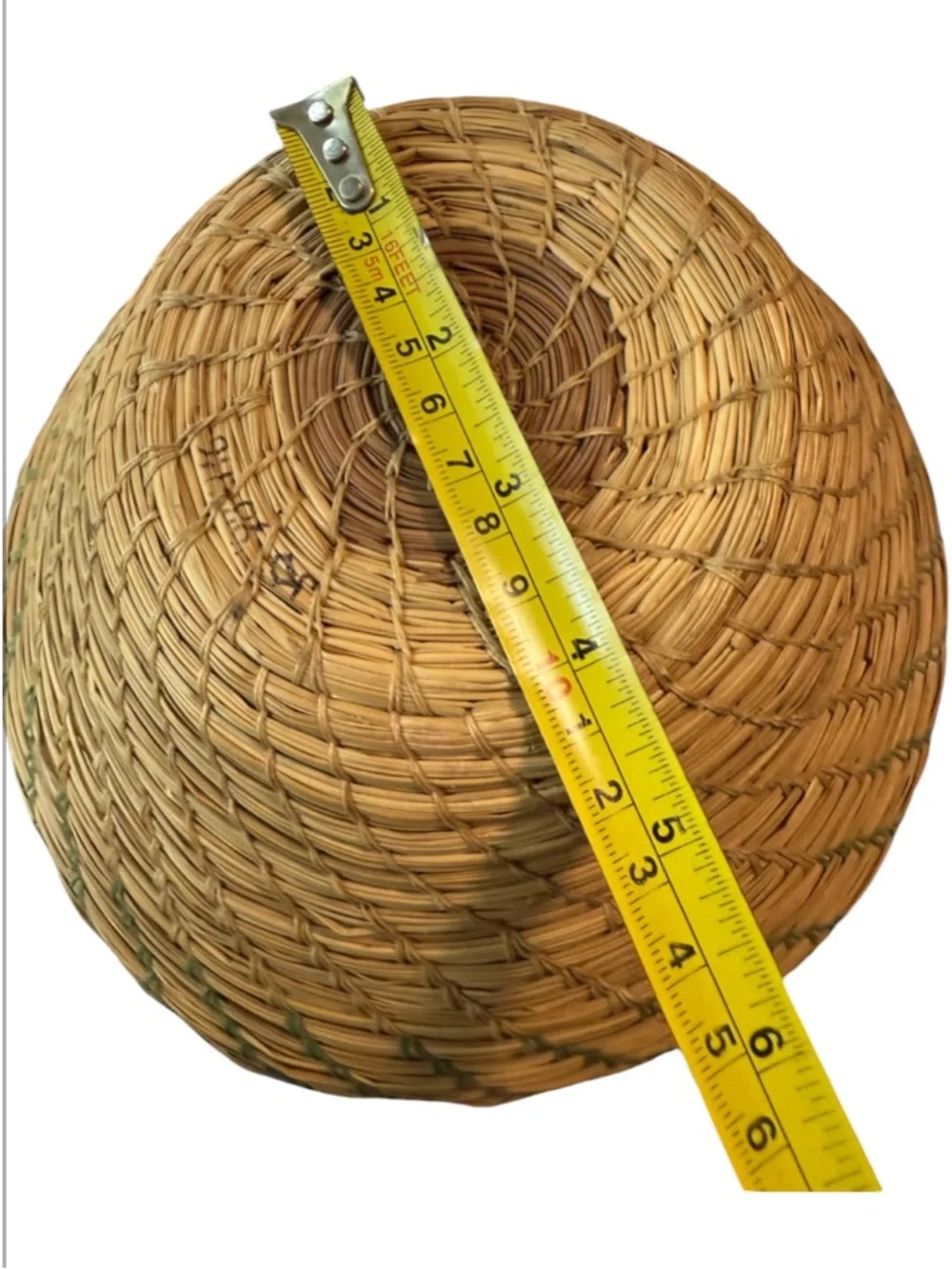 vintage Native American style pine needle basket, similar to those identified